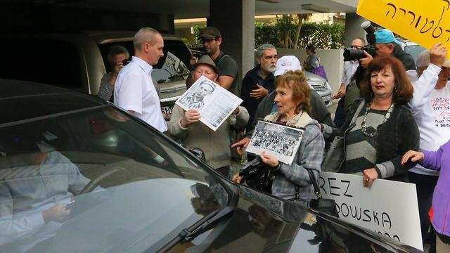 The diplomat encircled by the protestors 
