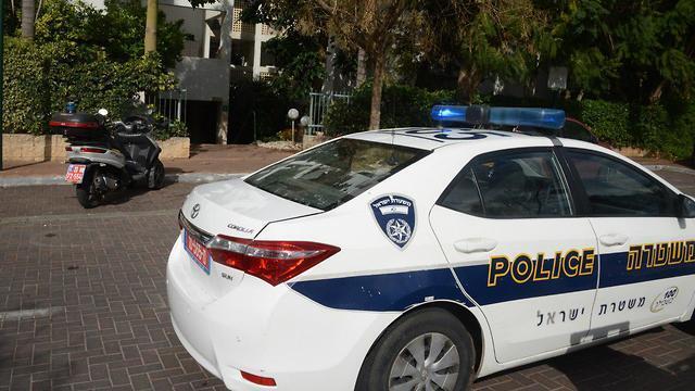 A police cruiser outside the couple's Ra'anana home