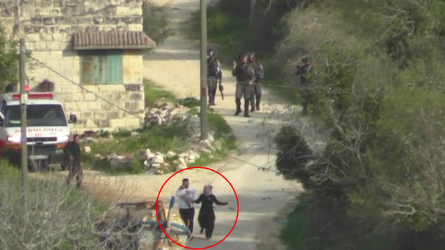 The Yesh Din footage showed a Border Policeman throw a stun grenade at Palestinian parents carrying an infant (circled)
