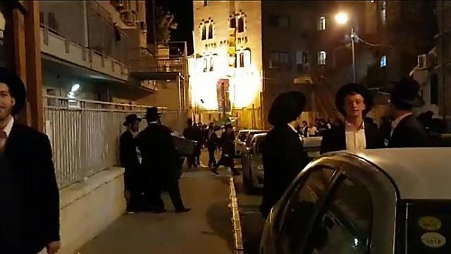 A crowd congregated outside the Strauss College in Jerusalem