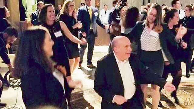 Sharansky and the Jewish Agency envoys dancing to Israeli tunes