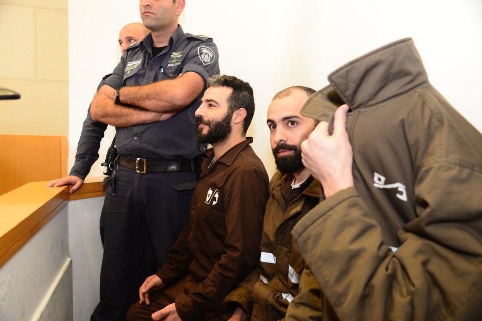 Romain Franck and two of the other defendants in court