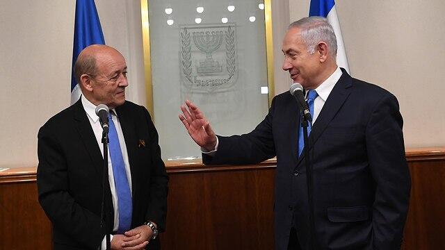 Prime Minister Netanyahu, right, meets with French Foreign Minister Jean-Yves Le Drian