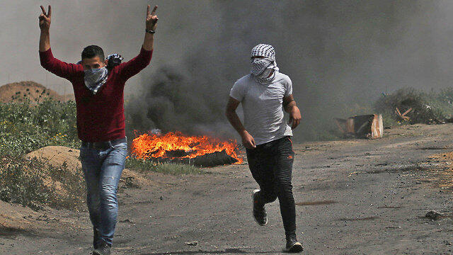 Palestinians riot near the Gaza border ahead of Friday's protests