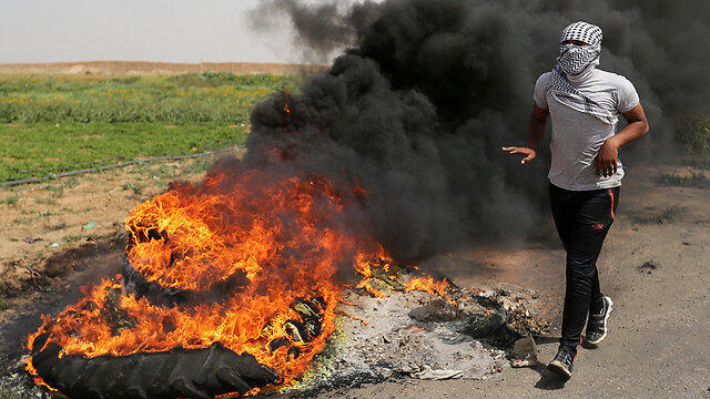 Palestinians riot near the Gaza border ahead of Friday's protests