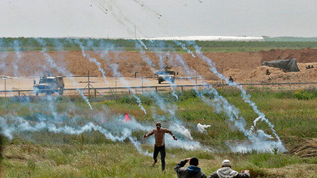 Tear gas dropped onto Palestinian rioters in Gaza
