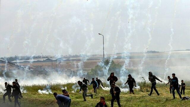 Tear gas dropped onto Palestinian rioters in Gaza