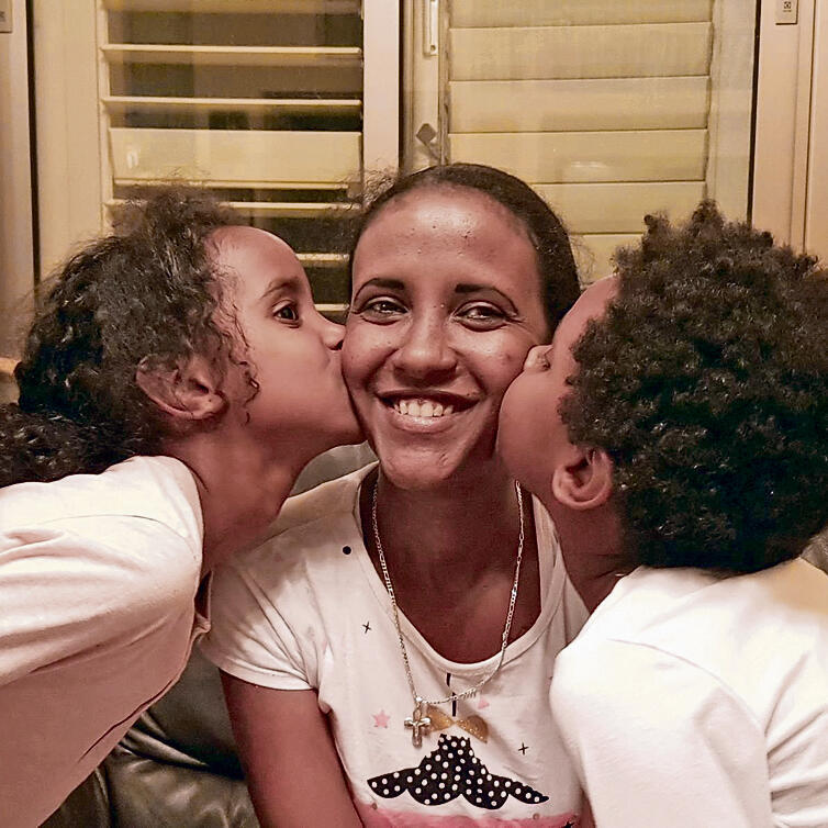 A family absorbed in a Kibbuz
