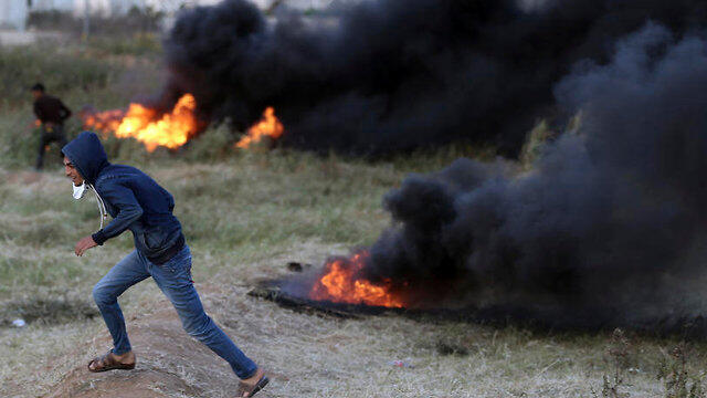 Tire burning at Gaza border protests