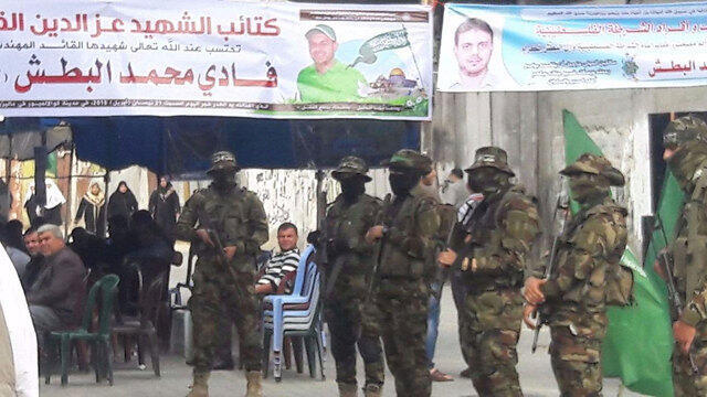 Members of Hamas's military wing at the entrance to Albatsh's mourners' tent