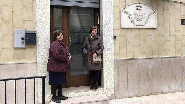 Lucia Zorro and her sister Josephina outside the village synagogue 