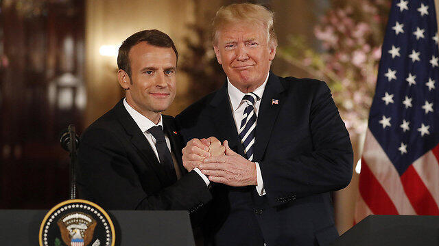 President Macron (L) lobbies President Trump to stay in the deal