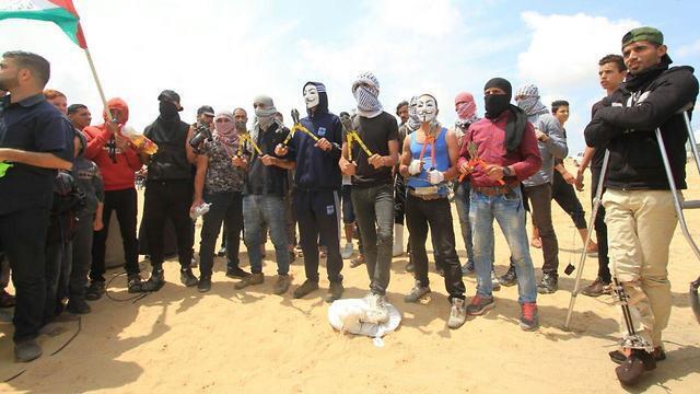 Protesters armed with bolt cutters threaten to breach Gaza border fence