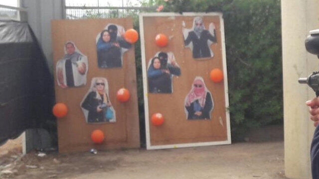 The keffiyeh-clad figures were to be used as target practice