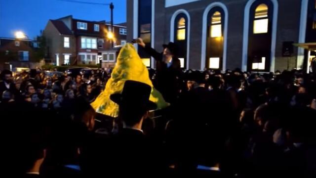 Fuel being poured on the bonfire