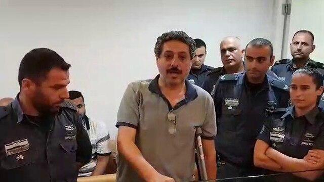 Mossawa Center Director Jafar Farah in court Saturday. The human rights activist said a cop broke his leg on purpose (צילום: אחיה ראב"ד) Mossawa Center Director Jafar Farah in court Saturday. The human rights activist said a cop broke his leg on purpose