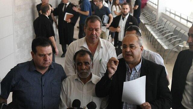 Joint List MKs Ayman Odeh, left, and Ahmad Tibi, right with Hussein Dawabsheh, center (צילום: יאיר שגיא) Joint List MKs Ayman Odeh, left, and Ahmad Tibi, right with Hussein Dawabsheh, center