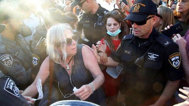 Police push back protesters