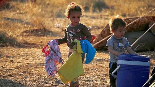 Сирийские юеженцы на иорданской границе. Фото: AFP