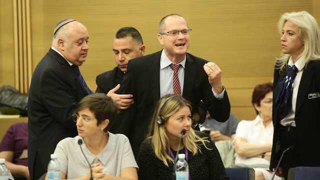 MK Oded Forer removed from the conference after interrupting the speakers (צילום: הלל מאיר/TPS) MK Oded Forer removed from the conference after interrupting the speakers
