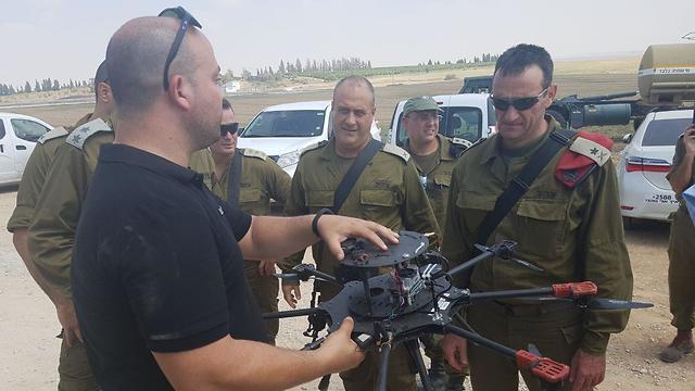 Maj. Gen. Halevi, right, and Brig. Gen Fuchs, center, shown the drone 