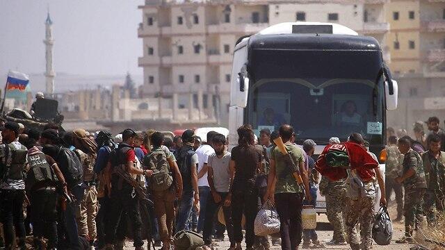 Повстанцы покидают Дераа. Фото: AFP