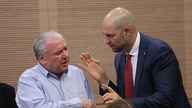 MK David Amsalem, left, and MK Amir Ohana