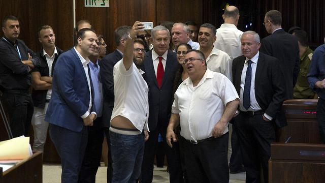 Likud ministers and MKs celebrate Nationality Law passage with a selfie (צילום: עמית שאבי) Likud ministers and MKs celebrate Nationality Law passage with a selfie