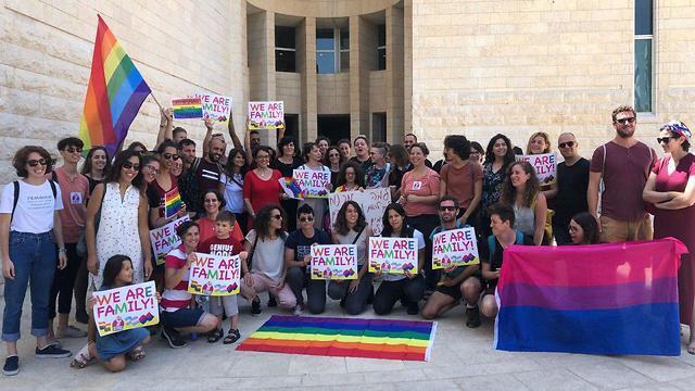 LGBT activists outside the courtroom