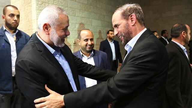 Hamas leader Ismail Hanieyh with Hamas official Husam Badran