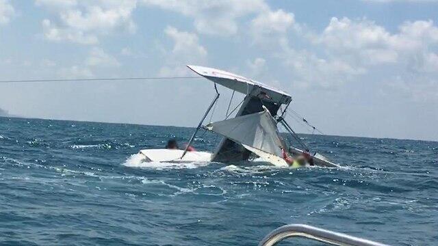 Capsized catamaran