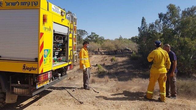 Firefighters near Kibbutz Be'eri