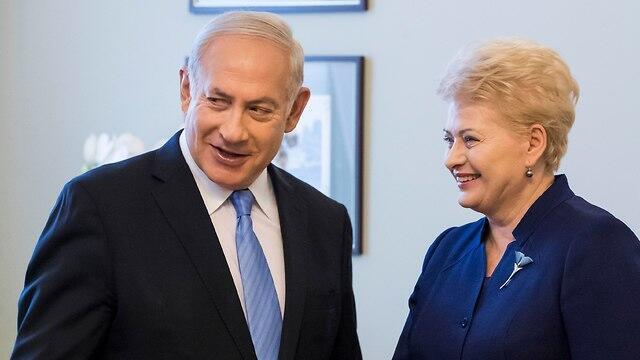 Lithuanian President Dalia Grybauskaite and PM Netanyahu (Photo: AFP) Lithuanian President Dalia Grybauskaite and PM Netanyahu