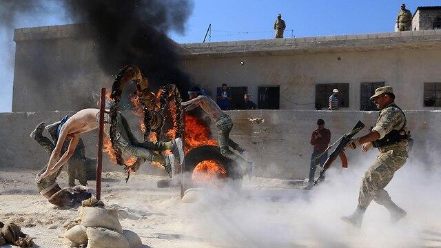 Rebel groups hold military drill