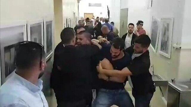 Court guards trying to stop the assailant