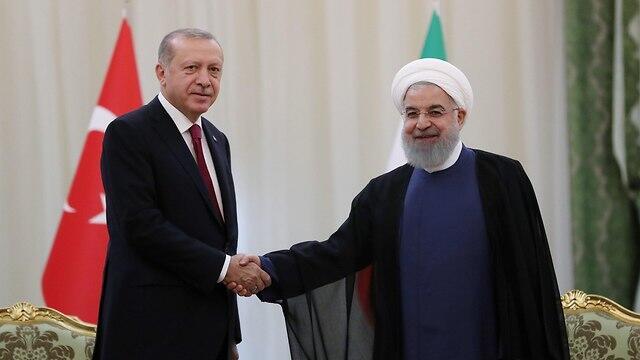 Erdogan (L) and Rouhani
