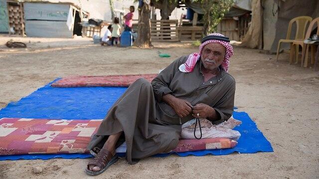 A resident of the Bedouin village