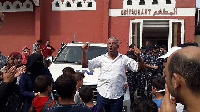 UNRWA's employees block the entrance to the Al Deira Hotel in Gaza 