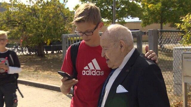 School students ask to take a selfie with Perel