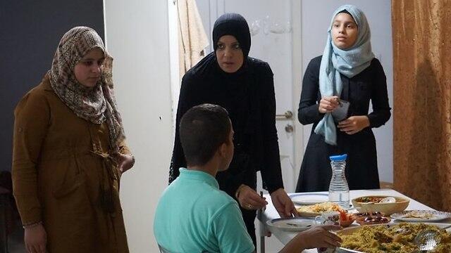 Juliette Bader inside her home with some of her children in Rahat