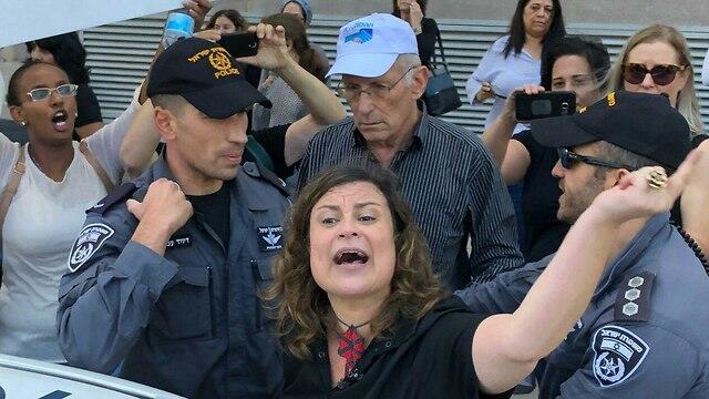 Inbal Hermoni, head of the Social Workers Union, getting arrested at the Tel Aviv protests earlier this year.nullnull Inbal Hermoni, head of the Social Workers Union, getting arrested at the Tel Aviv protests earlier this year.