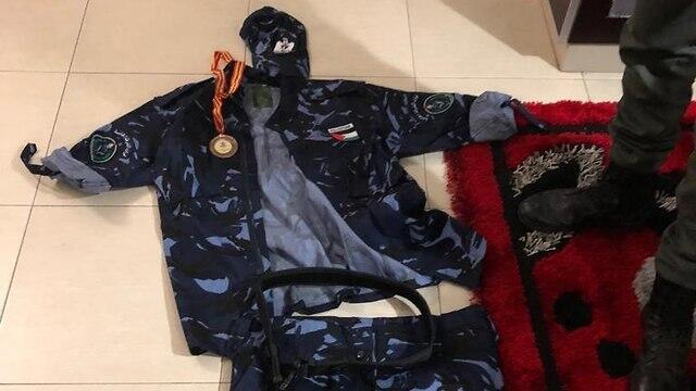 Uniform seized during searches of the suspects' homes (צילום: דוברות המשטרה) Uniform seized during searches of the suspects' homes