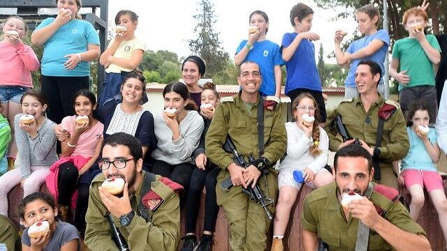 IDF soldiers meet with children near the Gaza border ahead of Hanukkah