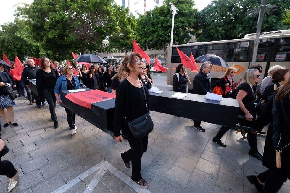 Protesters carry coffins in Tel Aviv