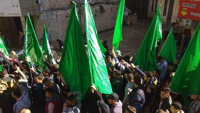 Hamas members mark the group's 31st anniversary with a rally in Nablusnullnull Hamas members mark the group's 31st anniversary with a rally in Nablus