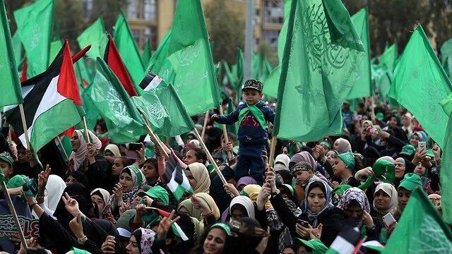 Hamas supporters attend a Gaza rally to mark the group's 31st anniversary (Photo: Reuters) (צילום: רויטרס) Hamas supporters attend a Gaza rally to mark the group's 31st anniversary (Photo: Reuters)