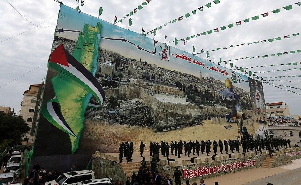Hamas holds a Gaza rally to mark the group's 31st anniversary (Photo: Reuters) (צילום: רויטרס) Hamas holds a Gaza rally to mark the group's 31st anniversary (Photo: Reuters)