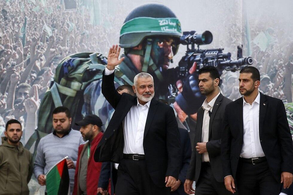 Hamas political leader Ismail Haniyeh attends a Gaza rally to mark the group's 31st anniversary (Photo: AFP) (צילום: AFP) Hamas political leader Ismail Haniyeh attends a Gaza rally to mark the group's 31st anniversary (Photo: AFP)