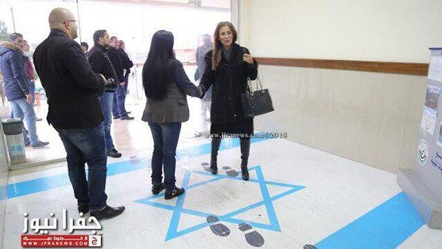 Jordan's inofrmation minister steps on Israeli flag (מתוך אתר jfranews) Jordan's inofrmation minister steps on Israeli flag
