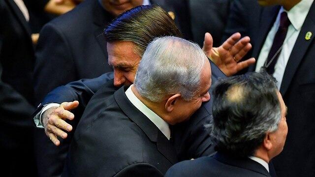 Prime Minister Benjamin Netanyahu with new Brazilian President Jair Bolsonaro at his inauguration (צילום: AFP) Prime Minister Benjamin Netanyahu with new Brazilian President Jair Bolsonaro at his inauguration
